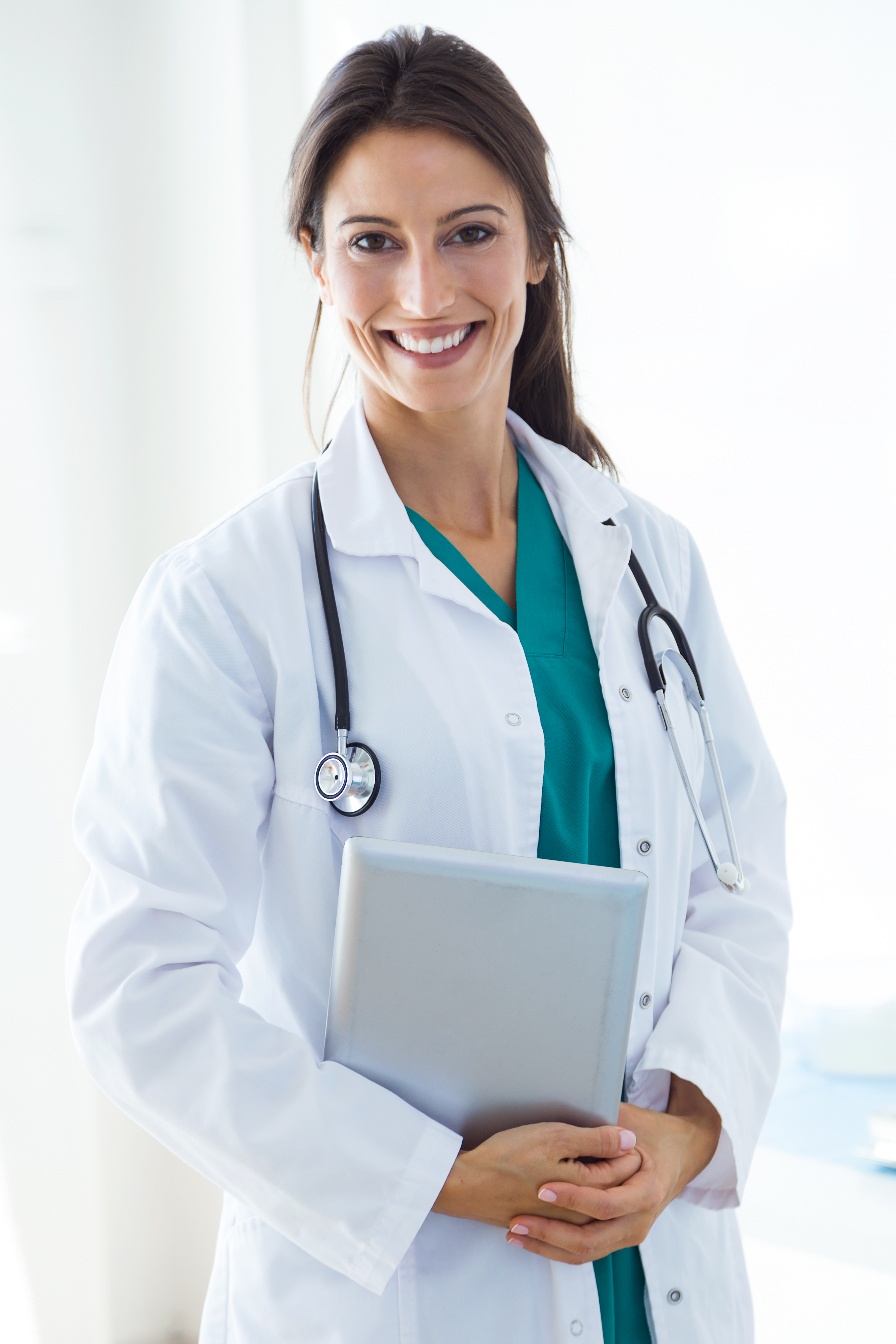 Beautiful young female doctor looking at camera in the office. Portrait of beautiful young female doctor looking at camera in the office.